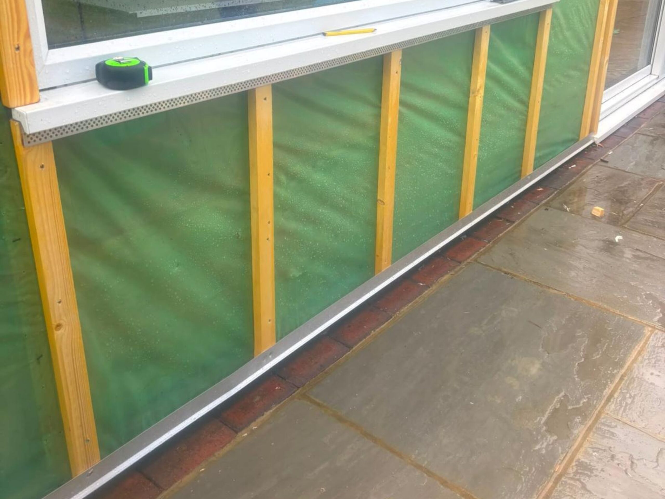 M3 Luton Garden Room Cladding Before and During Image 2