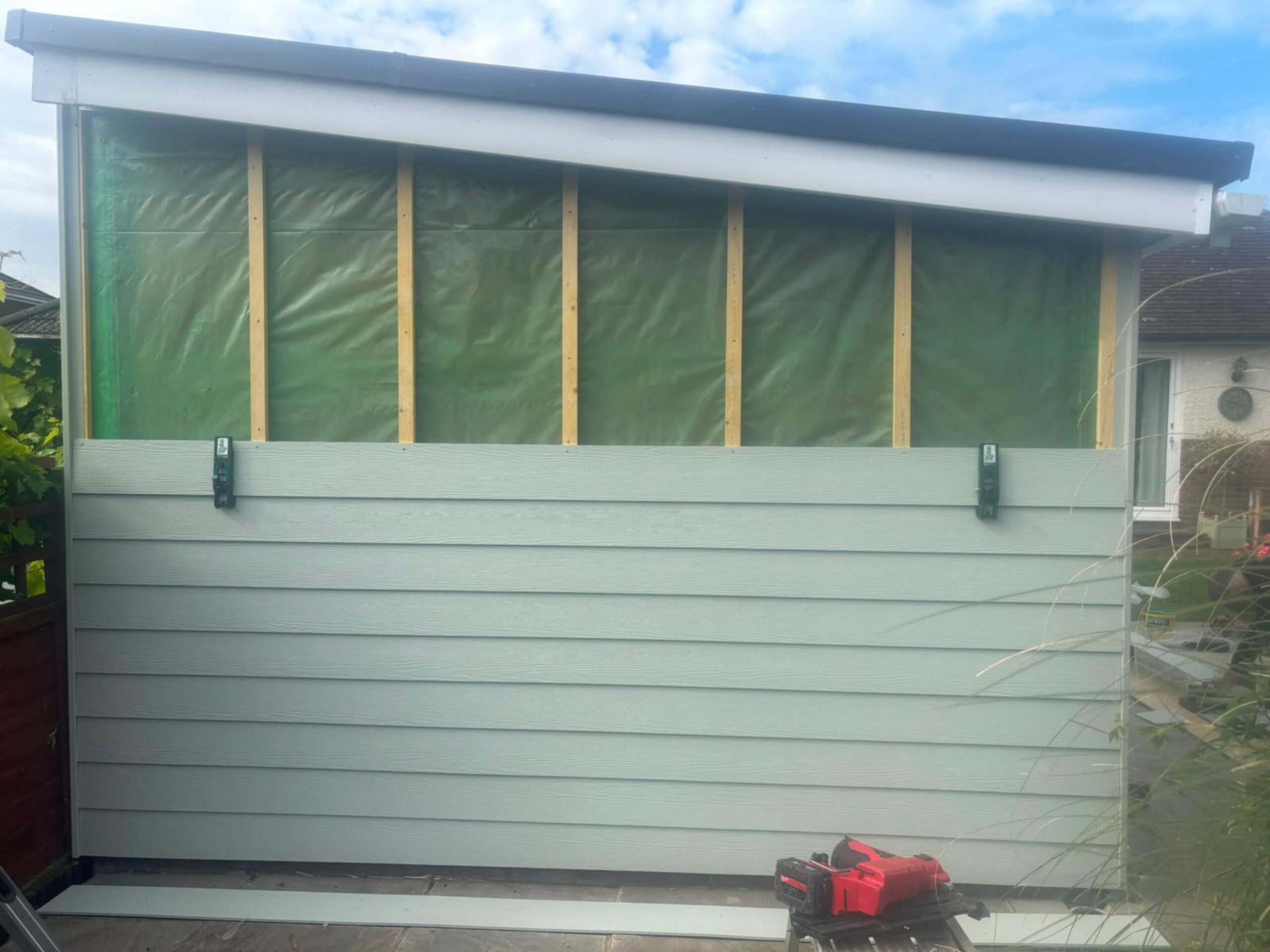 M3 Luton Garden Room Cladding Before and During Image 3